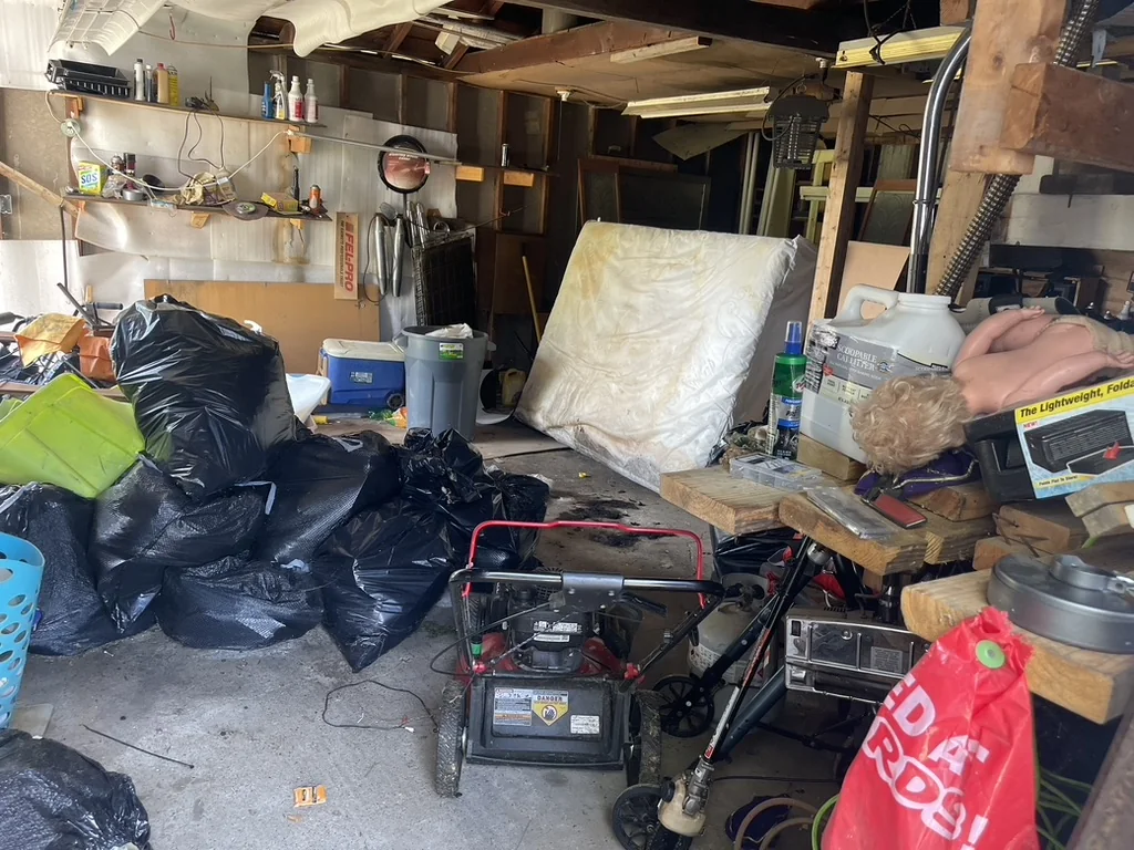 Garage and belongings at the Greenville probate property before cleanout