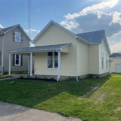 Yellow house renovated exterior